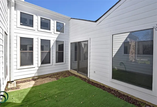 a view of a back yard of the house