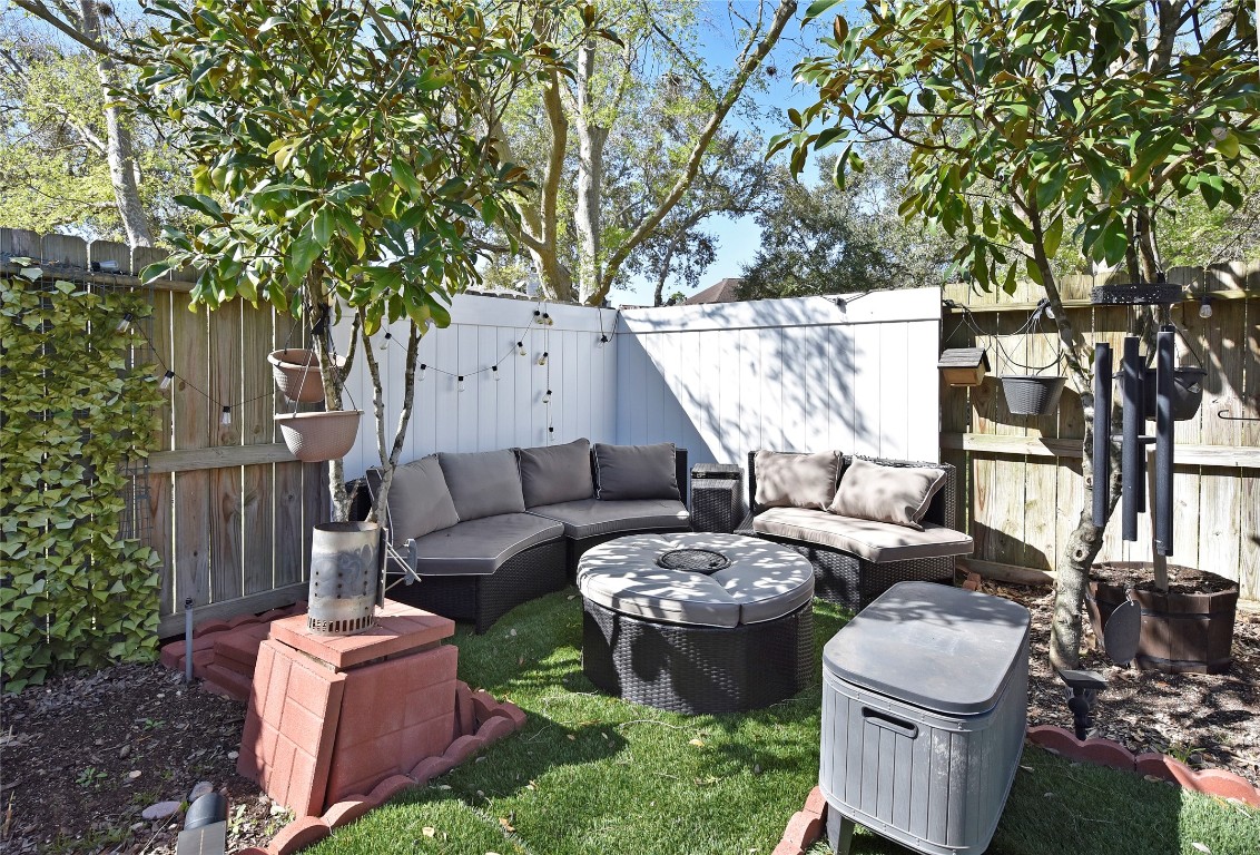 3203 East Rangecrest Place Sugar Land, TX 77479 - Photo 31 of 36 a couple of white chairs sitting in a backyard with a large tree