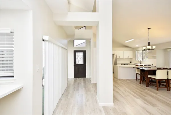 a view of a kitchen from the hallway
