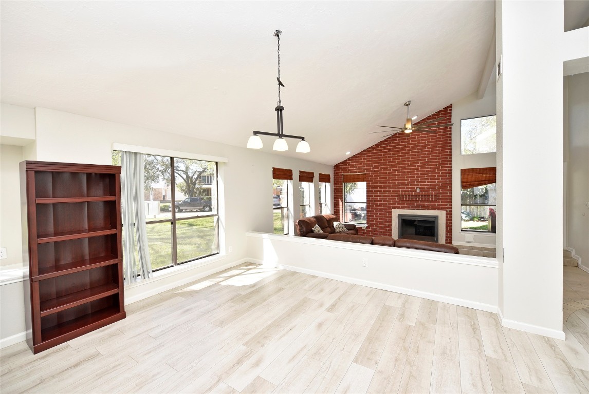 3203 East Rangecrest Place Sugar Land, TX 77479 - Photo 6 of 36 a view of an empty room with a fireplace and a window