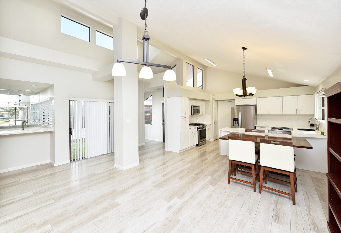 3203 East Rangecrest Place Sugar Land, TX 77479 - Photo 10 of 36 a view of a kitchen with dining table and chairs
