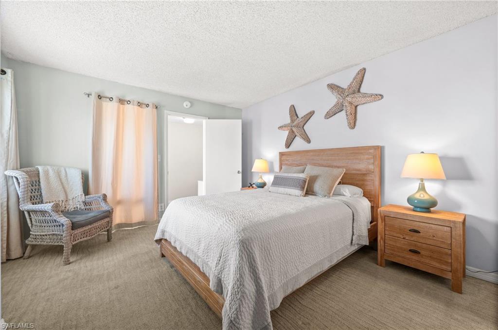 Undisclosed Address Naples, FL 34103 - Photo 13 of 24 a bedroom with a bed and a window