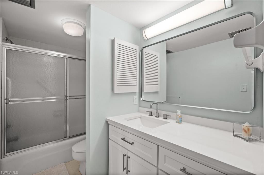 Undisclosed Address Naples, FL 34103 - Photo 14 of 24 a bathroom with a sink toilet and shower