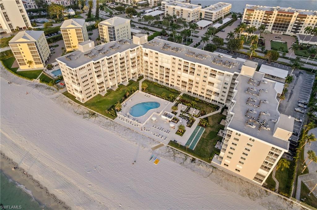 Undisclosed Address Naples, FL 34103 - Photo 19 of 24 an aerial view of a building with outdoor space