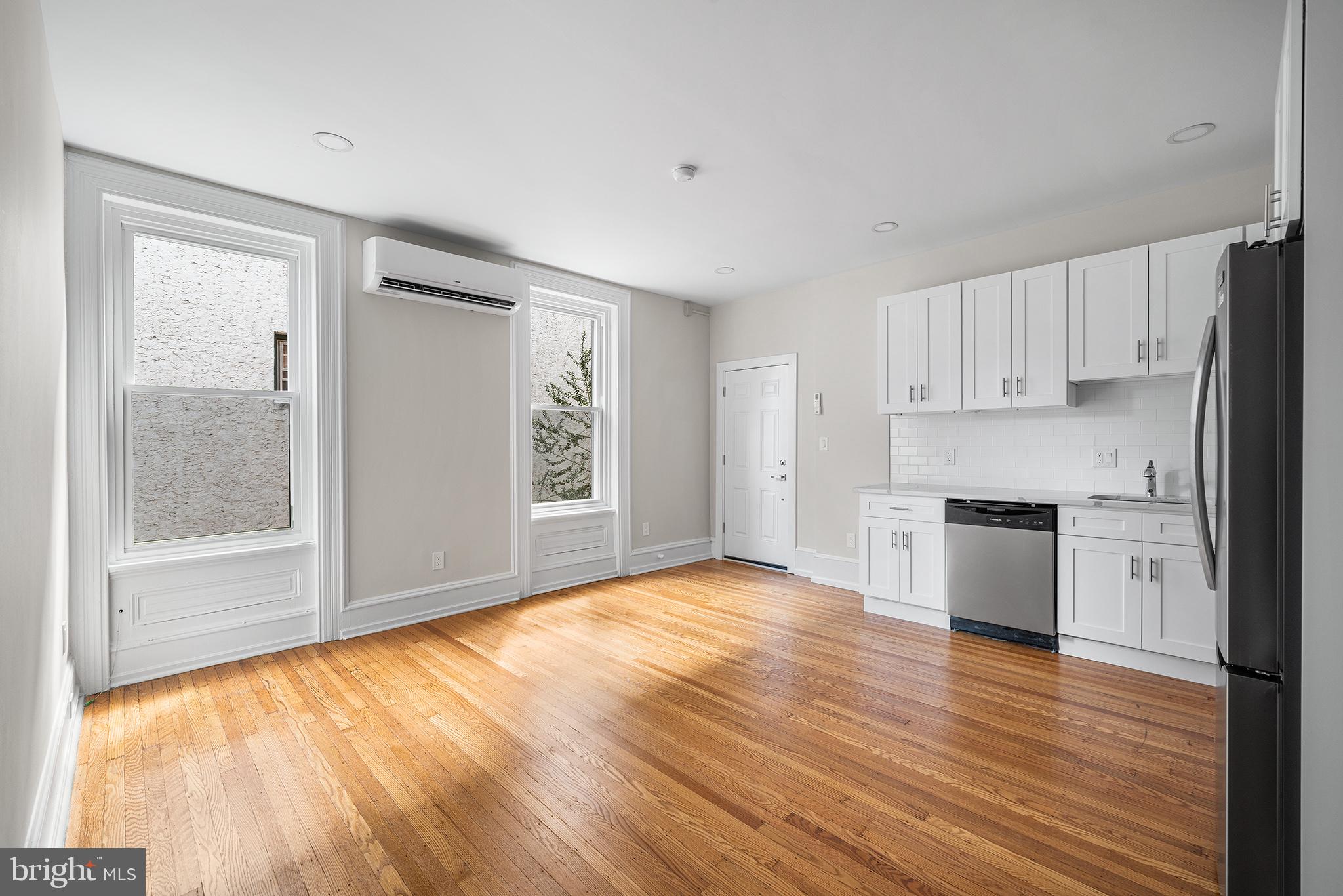 2309 Green Street, Unit 2R Philadelphia, PA 19130 - Photo 1 of 15 a view of kitchen with wooden floor and electronic appliances