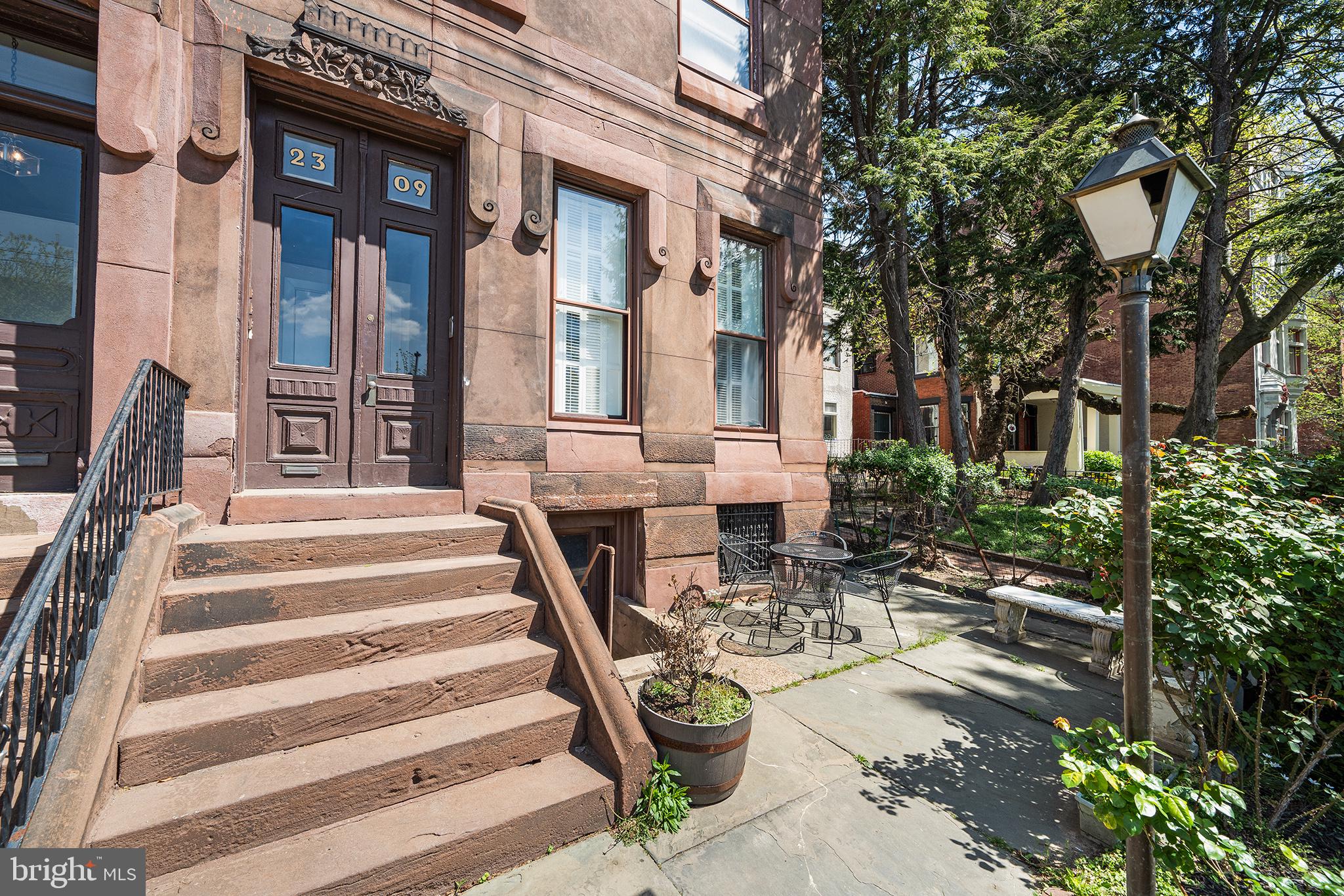 2309 Green Street, Unit 2R Philadelphia, PA 19130 - Photo 13 of 15 a view of a patio with couches table and chairs and potted plants