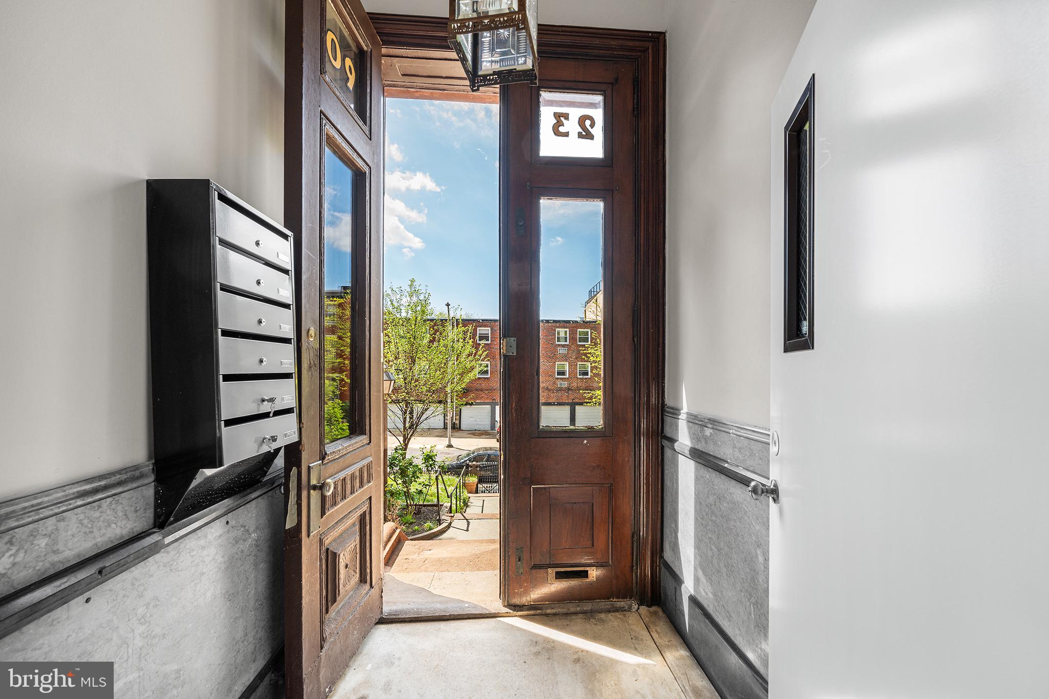 2309 Green Street, Unit 2R Philadelphia, PA 19130 - Photo 14 of 15 a view of a hallway with wooden floor and windows