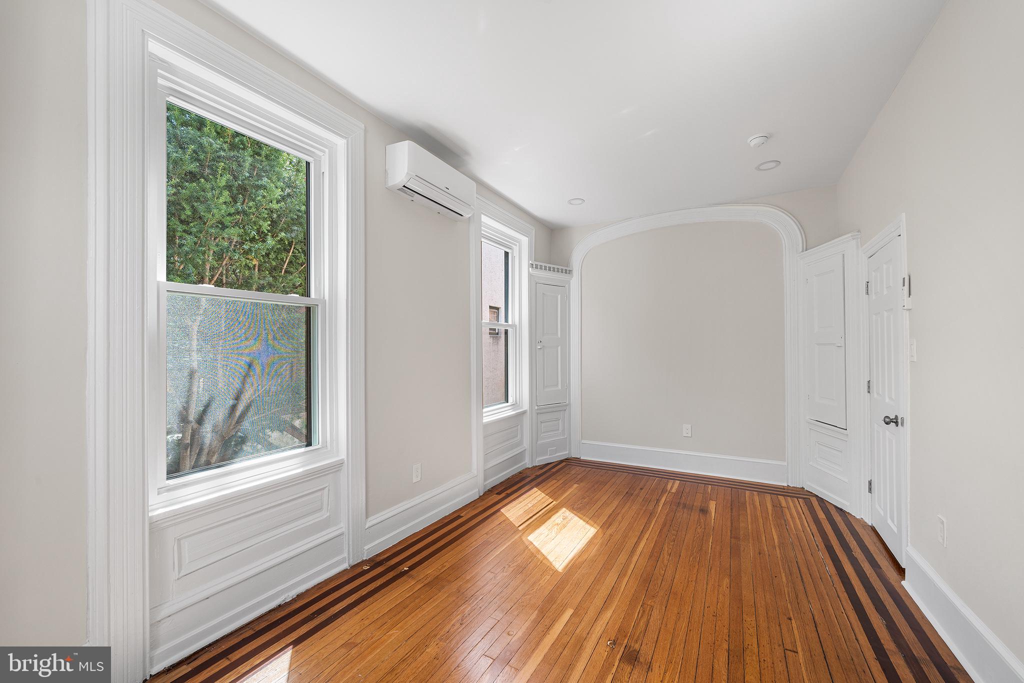2309 Green Street, Unit 2R Philadelphia, PA 19130 - Photo 9 of 15 a view of empty room with wooden floor and fan