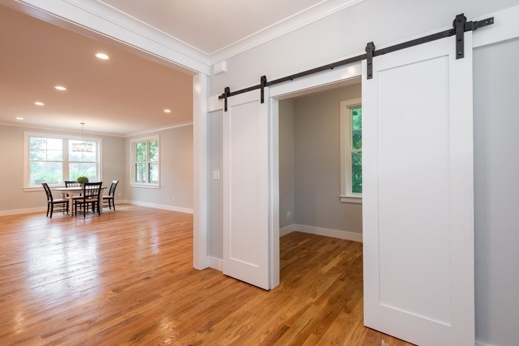 103 Francis Wyman Road Burlington, MA 01803 - Photo 12 of 42 a view of a room with wooden floor and a table