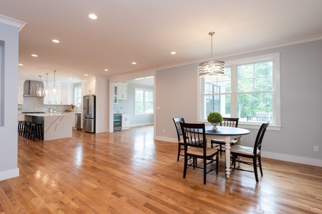 103 Francis Wyman Road Burlington, MA 01803 - Photo 15 of 42 a view of a dining room with furniture and wooden floor