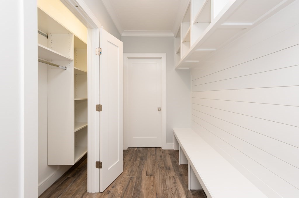 103 Francis Wyman Road Burlington, MA 01803 - Photo 18 of 42 a view of a hallway with wooden floor and staircase