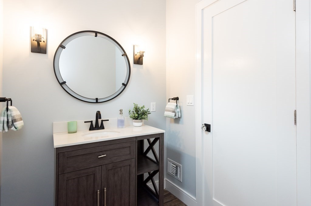 103 Francis Wyman Road Burlington, MA 01803 - Photo 19 of 42 a bathroom with a sink and a mirror