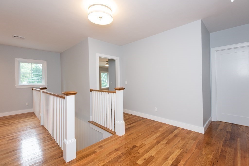 103 Francis Wyman Road Burlington, MA 01803 - Photo 22 of 42 a view of hallway with wooden floor