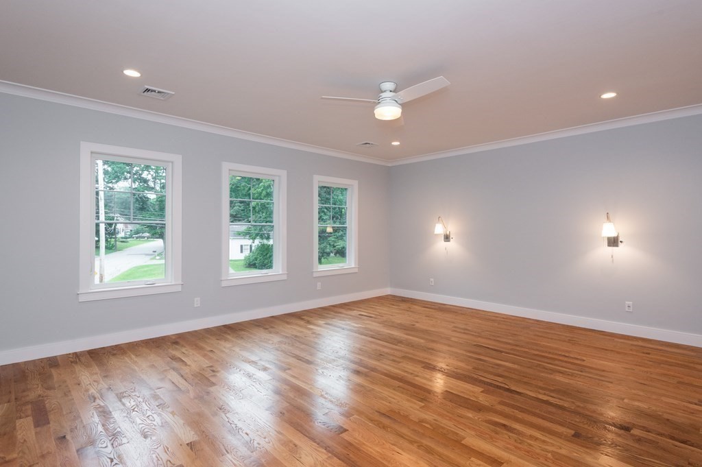 103 Francis Wyman Road Burlington, MA 01803 - Photo 23 of 42 an empty room with wooden floor and windows