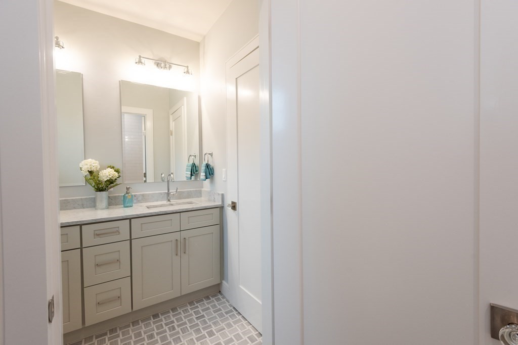 103 Francis Wyman Road Burlington, MA 01803 - Photo 34 of 42 a bathroom with a sink and a mirror