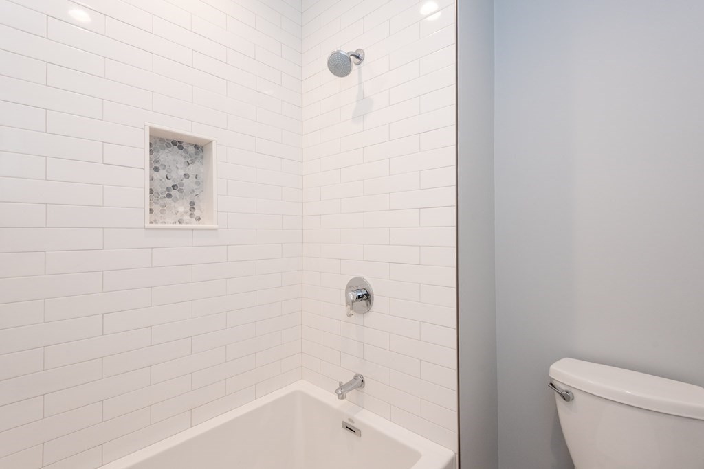 103 Francis Wyman Road Burlington, MA 01803 - Photo 35 of 42 a bathroom with a toilet and a tub