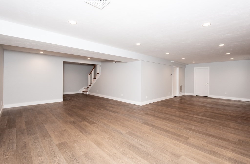 103 Francis Wyman Road Burlington, MA 01803 - Photo 36 of 42 a view of empty room with wooden floor and fan