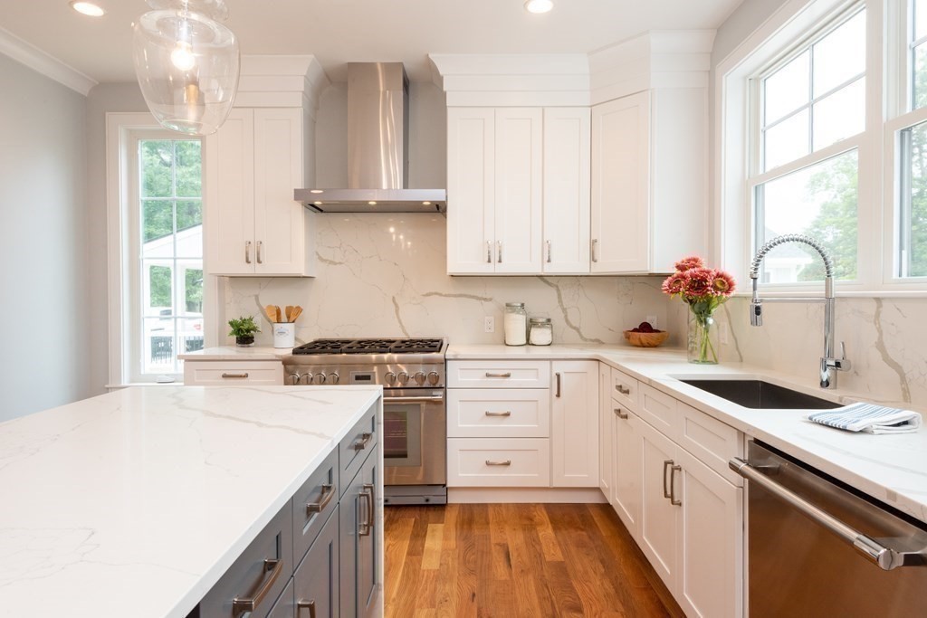 103 Francis Wyman Road Burlington, MA 01803 - Photo 5 of 42 a kitchen with a white cabinets and white appliances
