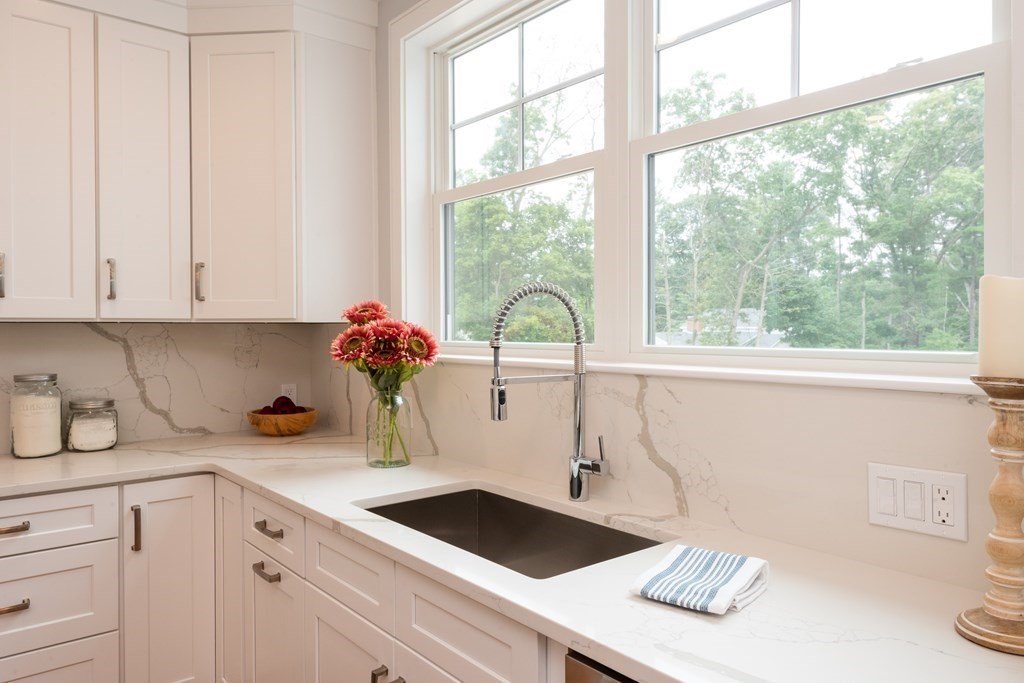 103 Francis Wyman Road Burlington, MA 01803 - Photo 7 of 42 a kitchen with a sink cabinets and window