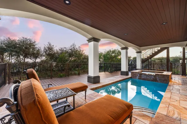 a kitchen with a sink a counter space appliances and cabinets
