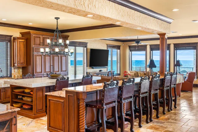 a bedroom with a large bed and a large window with outer view