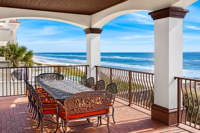a spacious bedroom with a bed a flat screen tv and a fireplace