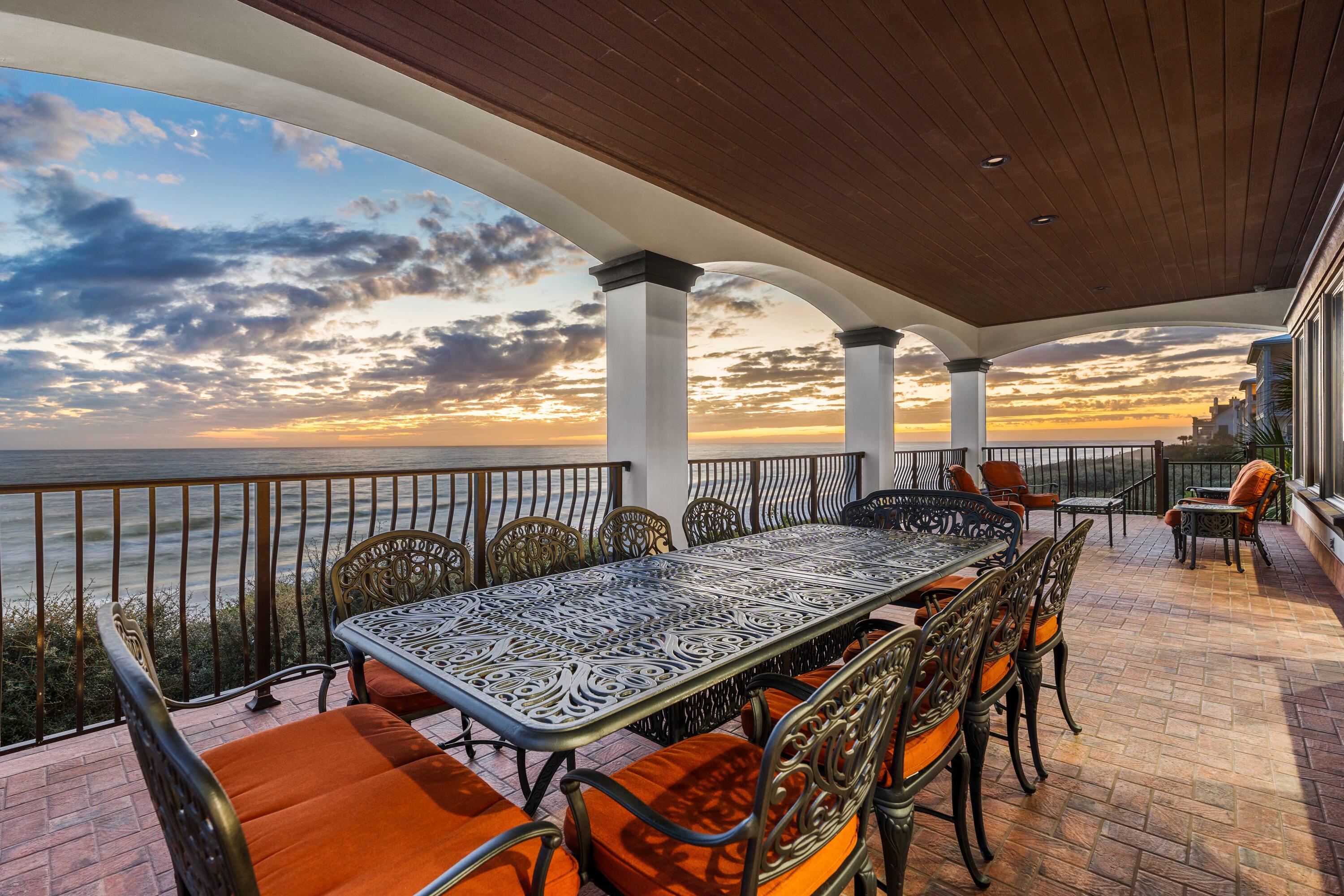 107 Elysee Court Inlet Beach, FL 32461 - Photo 30 of 98 a roof deck with a dining table and chairs with wooden floor