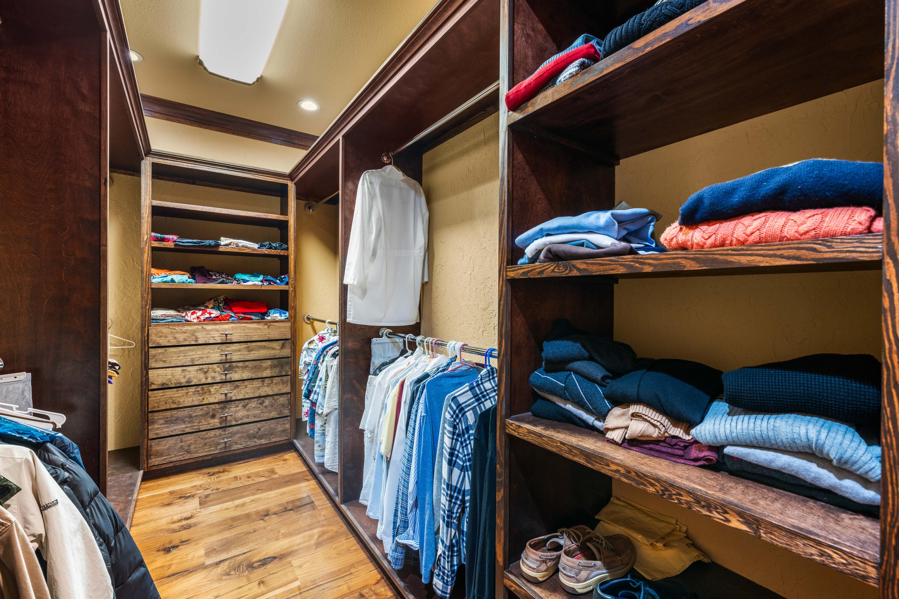 107 Elysee Court Inlet Beach, FL 32461 - Photo 65 of 98 a view of walk in closet with clothes and shoes