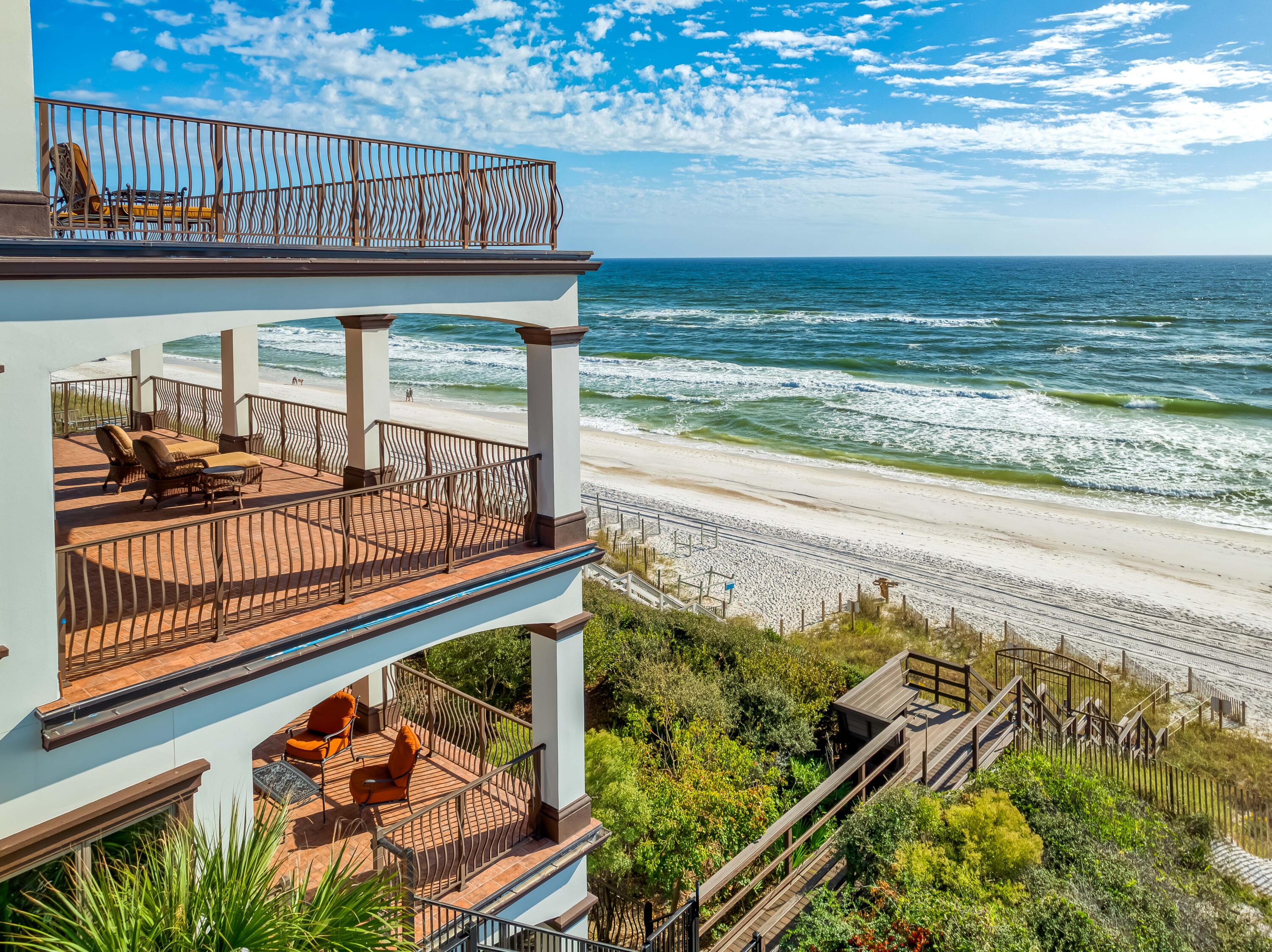 107 Elysee Court Inlet Beach, FL 32461 - Photo 91 of 98 a view of a balcony with wooden floor and outdoor seating