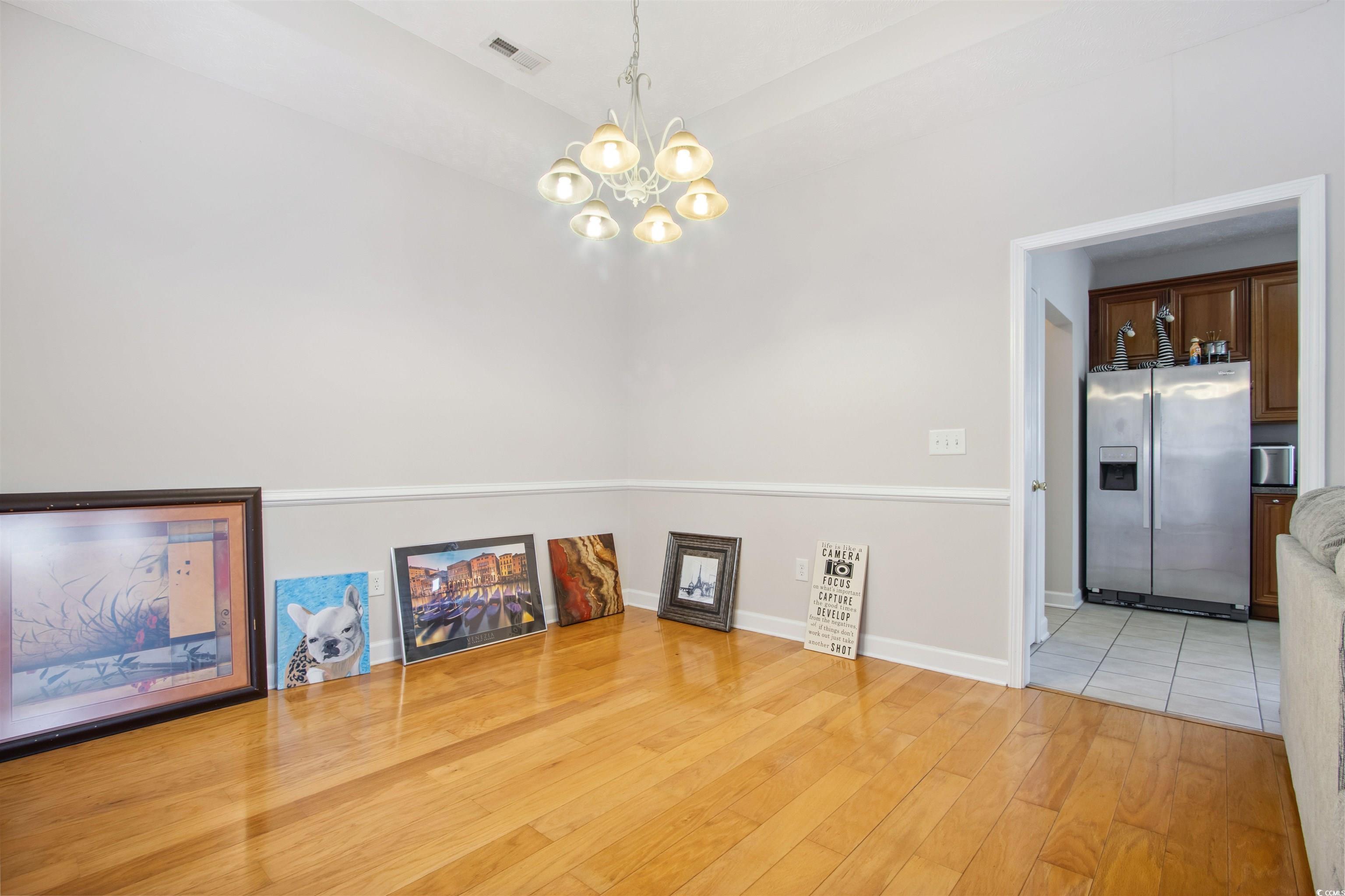 Undisclosed Address Conway, SC 29526 - Photo 21 of 26 Unfurnished dining area featuring a chandelier and light wood finished floors