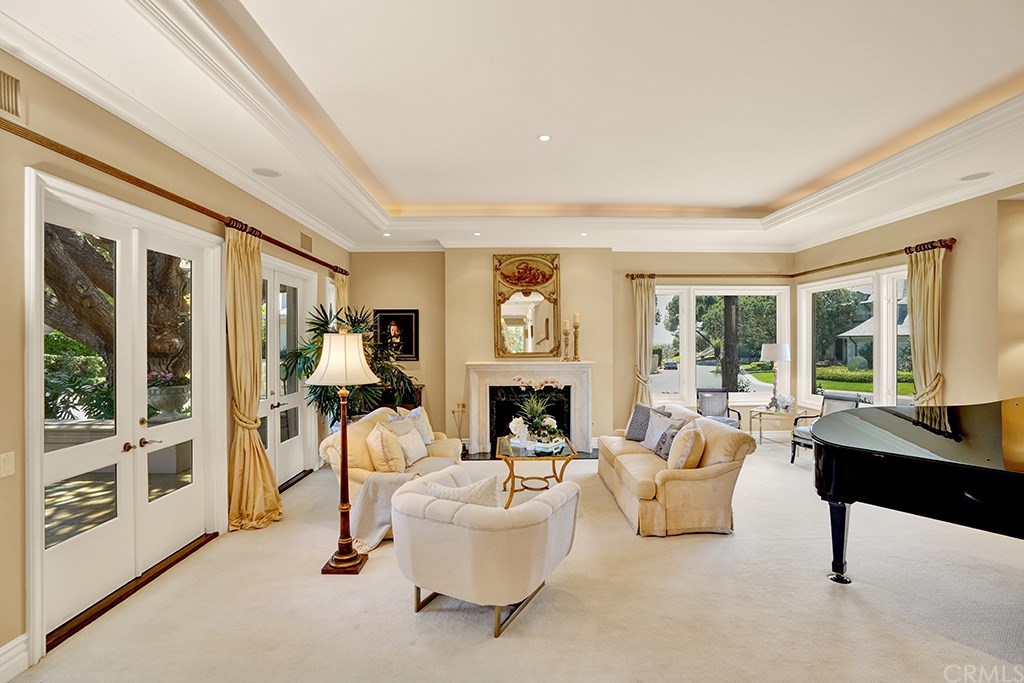 34 Smithcliffs Road Laguna Beach, CA 92651 - Photo 15 of 69 a living room with furniture and a fireplace