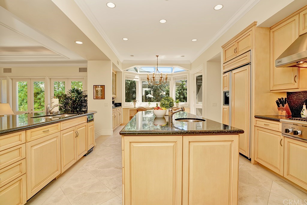 34 Smithcliffs Road Laguna Beach, CA 92651 - Photo 16 of 69 a kitchen with stainless steel appliances granite countertop a sink and cabinets
