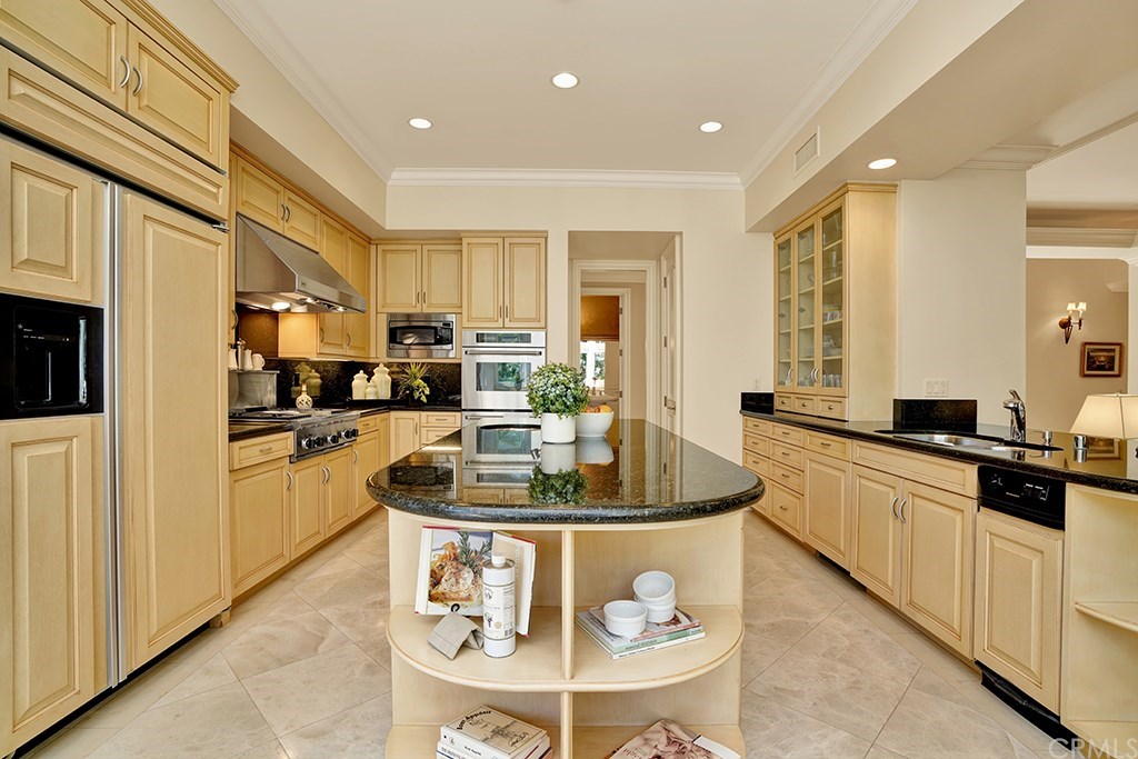 34 Smithcliffs Road Laguna Beach, CA 92651 - Photo 18 of 69 a kitchen with stainless steel appliances granite countertop a sink a stove and a refrigerator