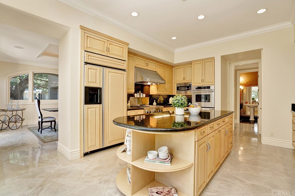 34 Smithcliffs Road Laguna Beach, CA 92651 - Photo 20 of 69 a kitchen with stainless steel appliances granite countertop a sink and white cabinets
