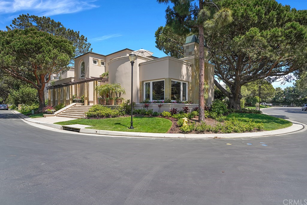 34 Smithcliffs Road Laguna Beach, CA 92651 - Photo 2 of 69 a front view of a house with a yard and garage