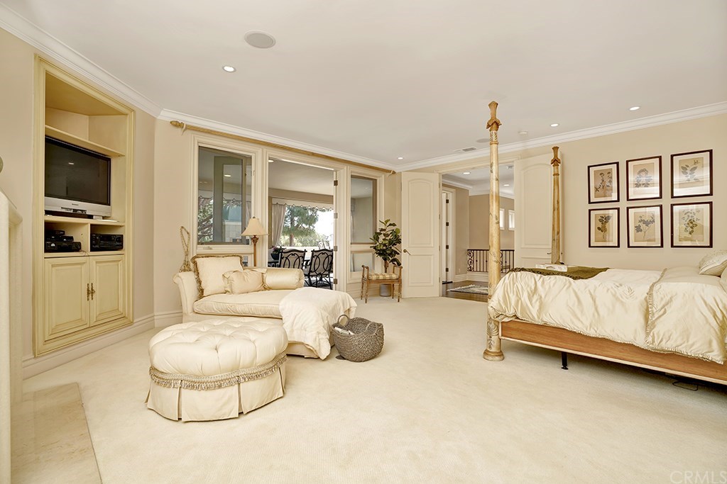 34 Smithcliffs Road Laguna Beach, CA 92651 - Photo 46 of 69 a spacious bedroom with a bed a couch and large window