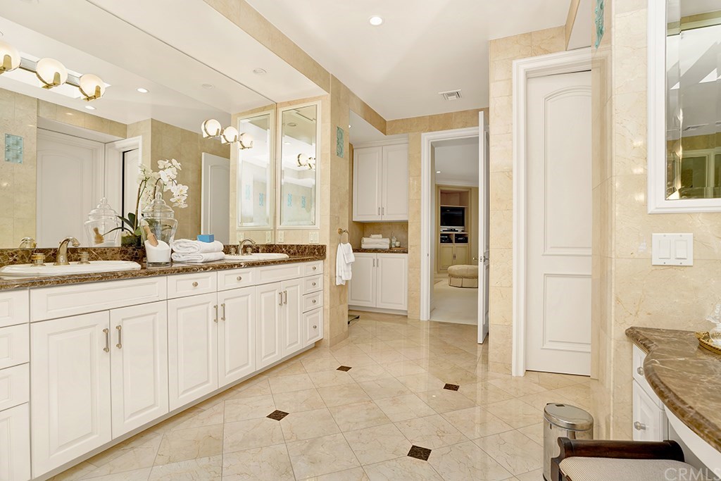 34 Smithcliffs Road Laguna Beach, CA 92651 - Photo 52 of 69 a spacious bathroom with a double vanity sink a mirror and a shower