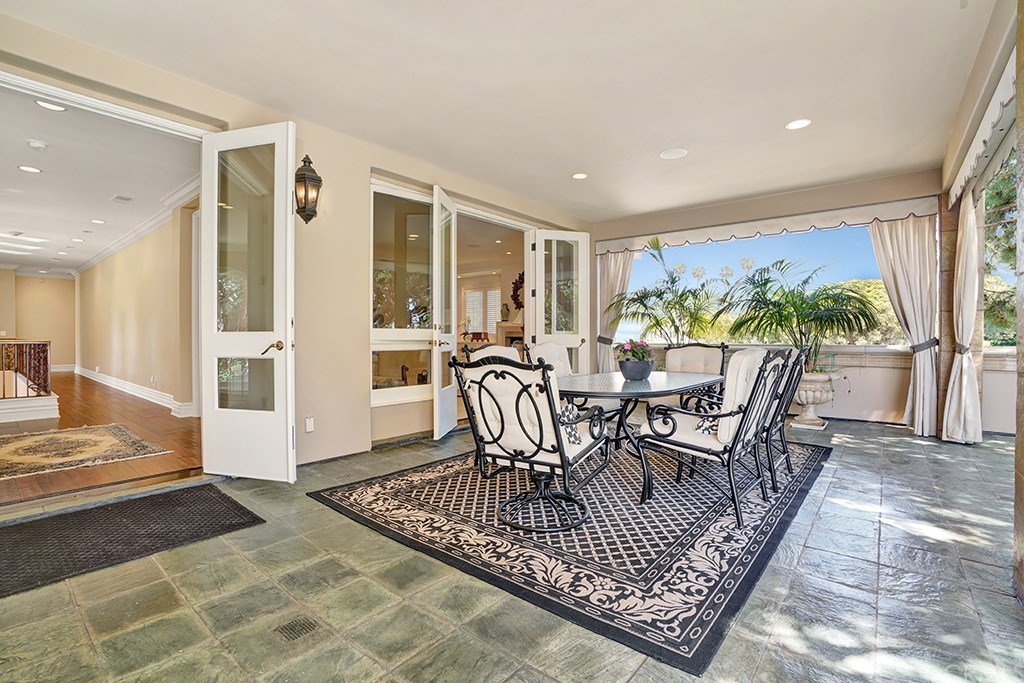 34 Smithcliffs Road Laguna Beach, CA 92651 - Photo 54 of 69 a view of a dining room with furniture window and wooden floor