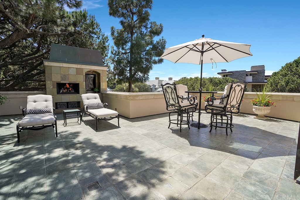 34 Smithcliffs Road Laguna Beach, CA 92651 - Photo 55 of 69 a view of a patio with couches under an umbrella
