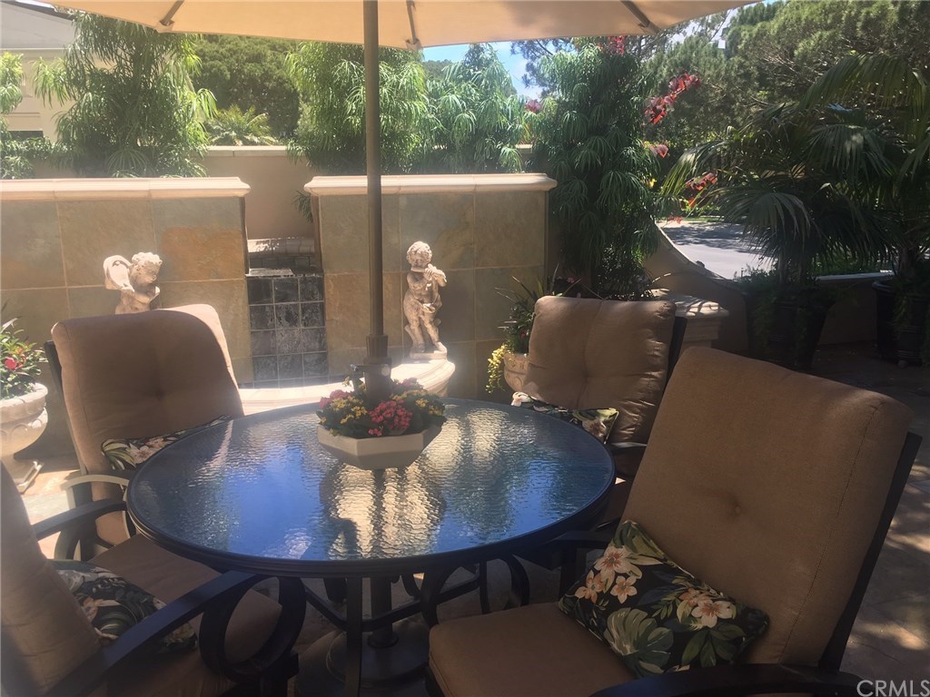 34 Smithcliffs Road Laguna Beach, CA 92651 - Photo 57 of 69 a view of a dining room with furniture and wooden floor