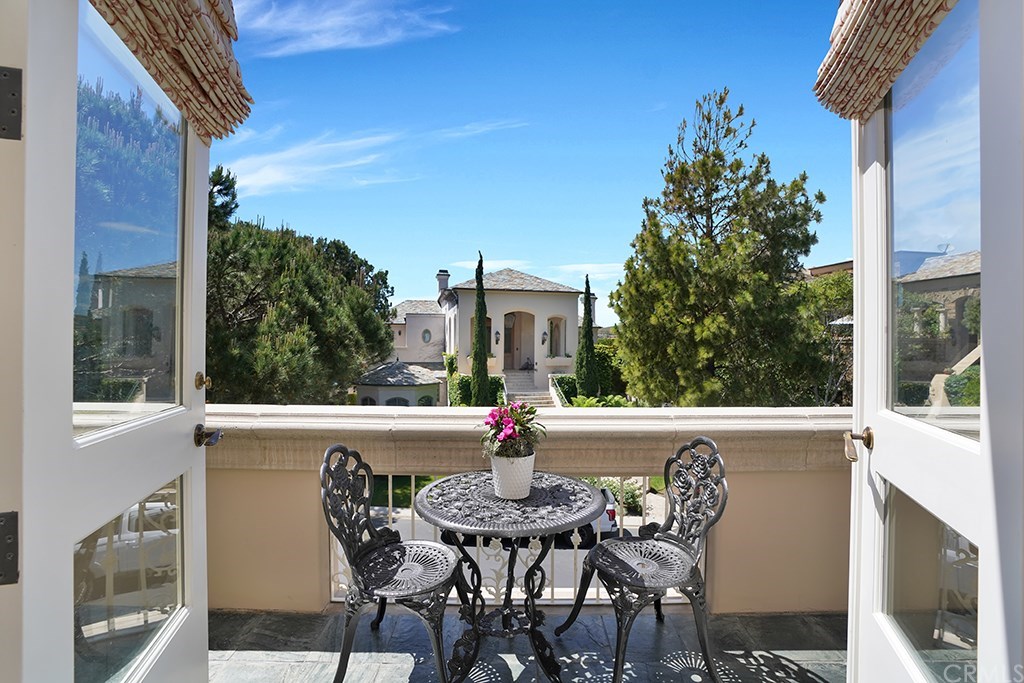 34 Smithcliffs Road Laguna Beach, CA 92651 - Photo 61 of 69 a view of deck with table and chairs and potted plants
