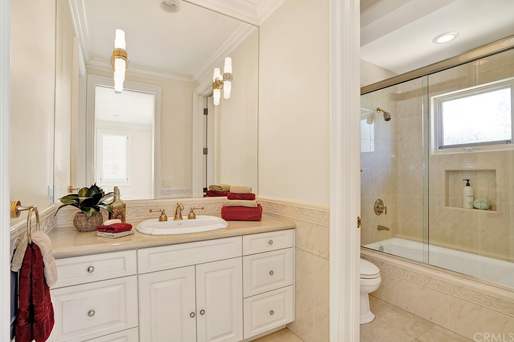 34 Smithcliffs Road Laguna Beach, CA 92651 - Photo 64 of 69 a bathroom with double vanity sink a mirror a shower and a bathtub