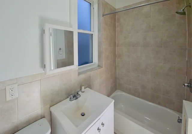 a bathroom with a sink and a bathtub