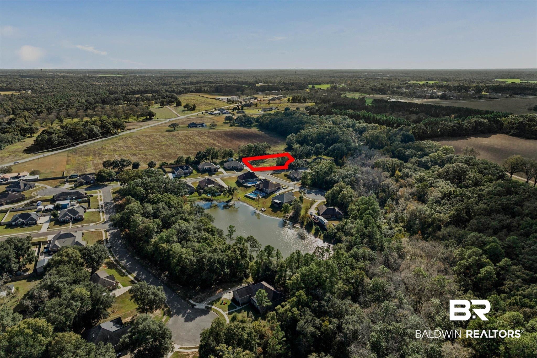 0 Acorn Way Grand Bay, AL 36541 - Photo 13 of 17 Aerial view of property and surrounding area with a heavily wooded area and a nearby body of water