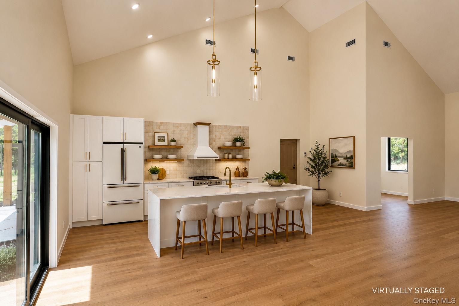 128 St Elmo Road Wallkill, NY 12589 - Photo 45 of 45 Open floor plan showing view from dining area to the kitchen with Kitchen Island and breakfast bar. Virtually staged. Furniture has been digitally added to show the room's potential scale and layout."