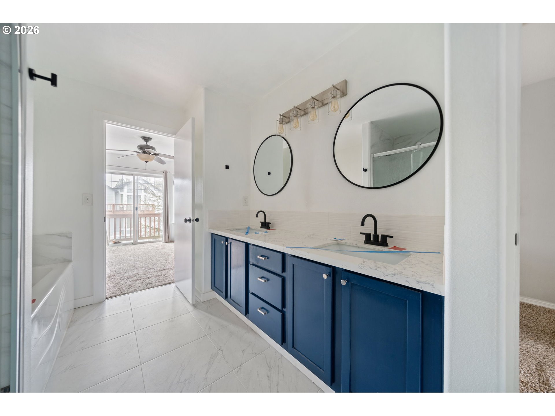 4416 Northeast Nicholson Loop Vancouver, WA 98661 - Photo 24 of 25 a bathroom with a granite countertop double vanity sink and a mirror