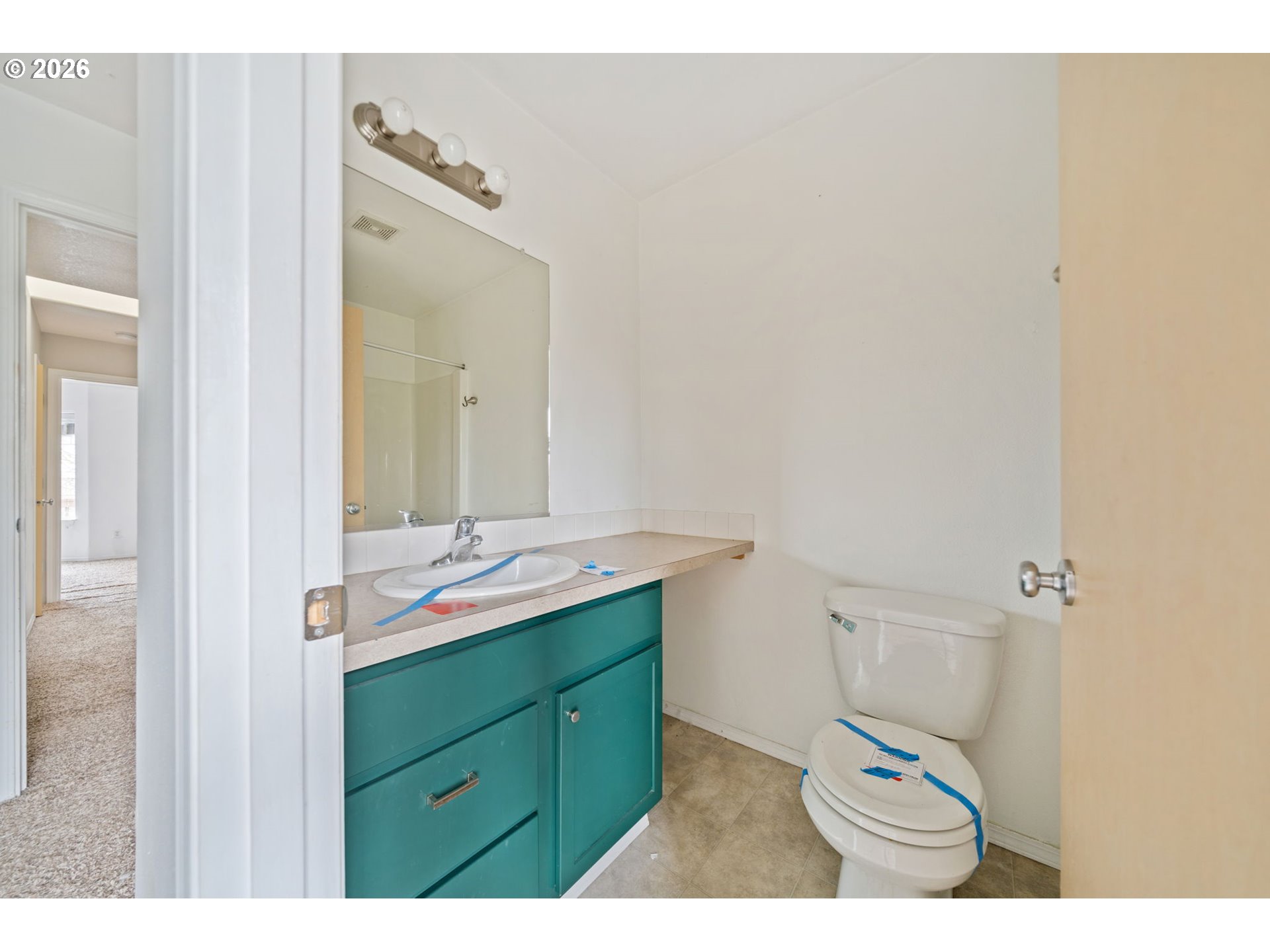 4416 Northeast Nicholson Loop Vancouver, WA 98661 - Photo 25 of 25 a bathroom with a sink and mirror