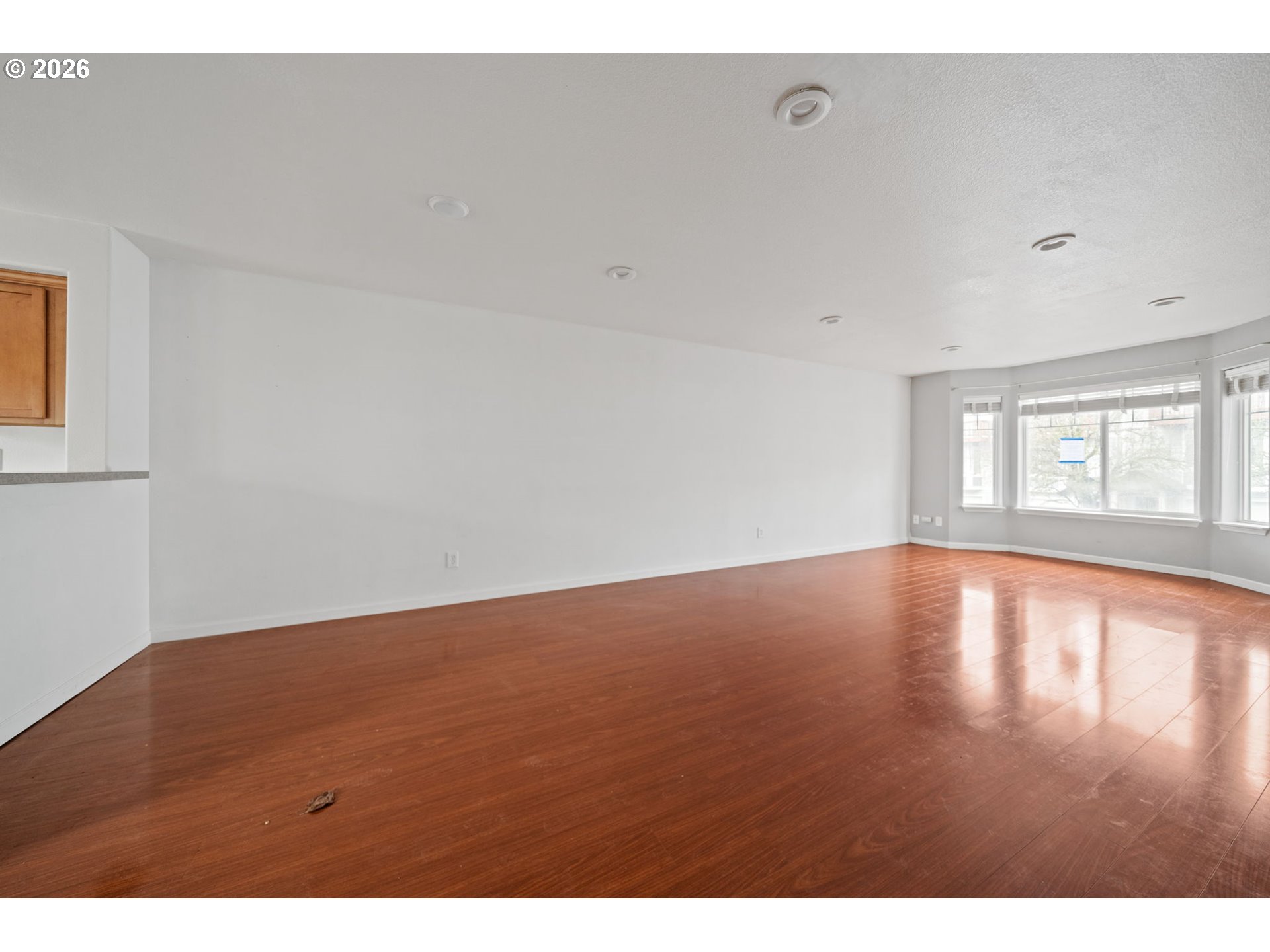 4416 Northeast Nicholson Loop Vancouver, WA 98661 - Photo 6 of 25 a view of empty room with wooden floor and fan