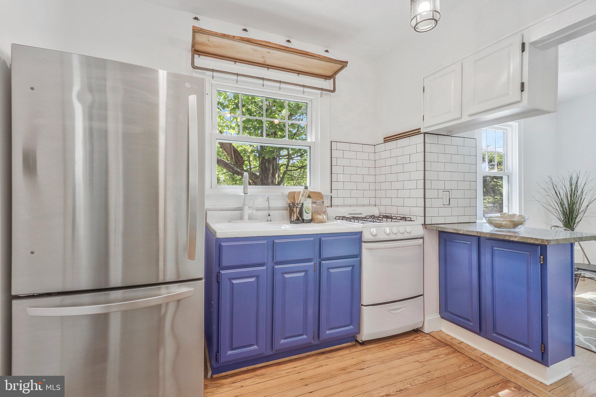4101 Madison Street Hyattsville, MD 20781 - Photo 11 of 28 Fun window farm sink granite kitchen counters.