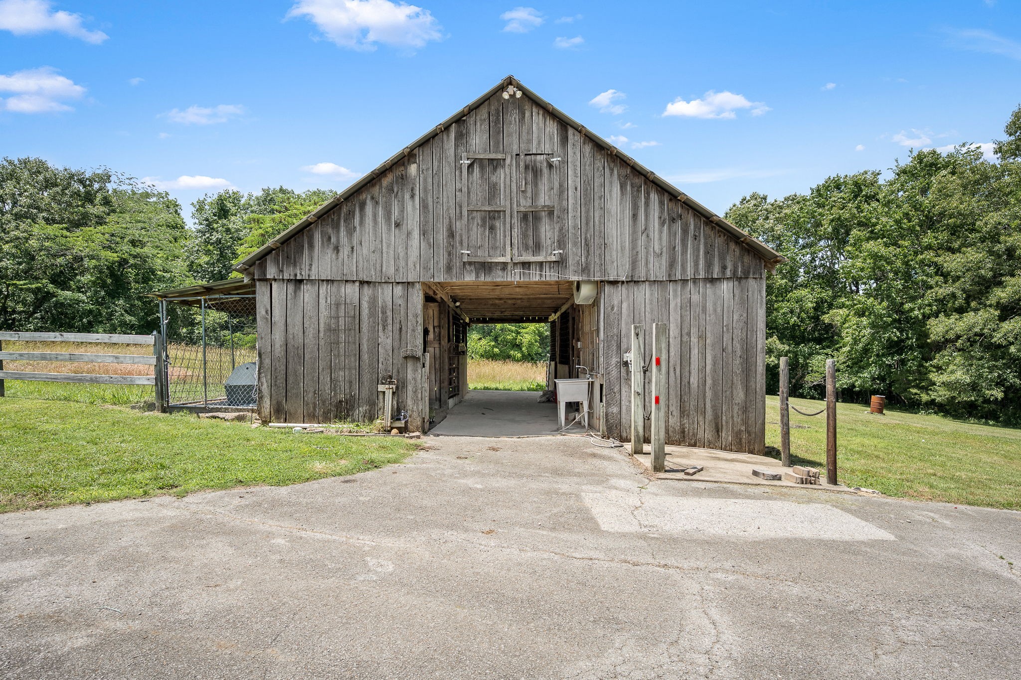 250 Home Pl Road Dickson, TN 37055 - Photo 62 of 62 a wooden fence with a bench in front of it